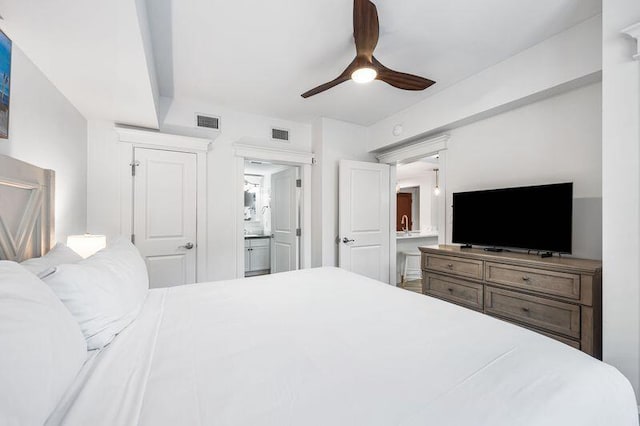 bedroom featuring ceiling fan and ensuite bath