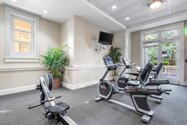 workout area with a paneled ceiling