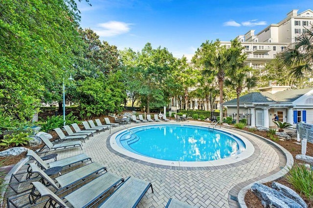 view of swimming pool featuring a patio area