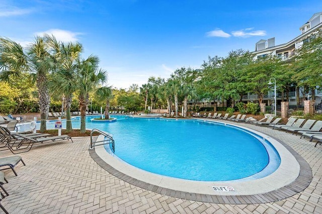 view of swimming pool with a patio