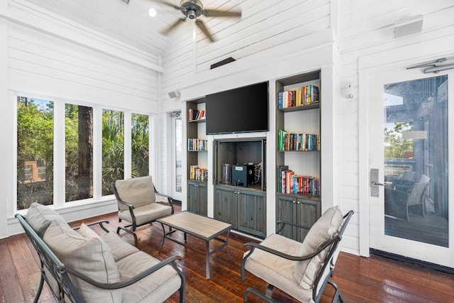 sunroom with ceiling fan and lofted ceiling