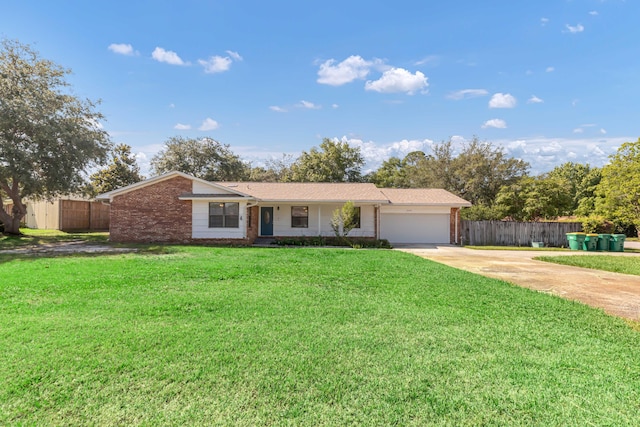 ranch-style home with a garage and a front lawn