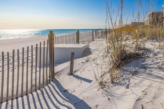 exterior space featuring a view of the beach and a water view