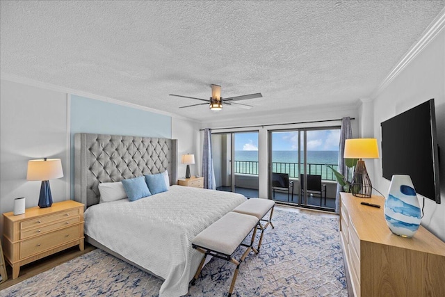 bedroom with crown molding, ceiling fan, access to exterior, hardwood / wood-style floors, and a textured ceiling