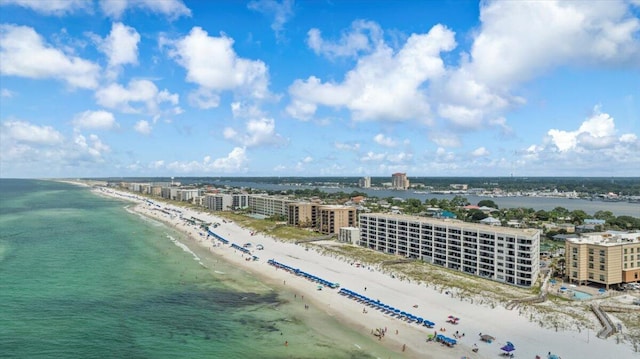 bird's eye view featuring a view of the beach and a water view