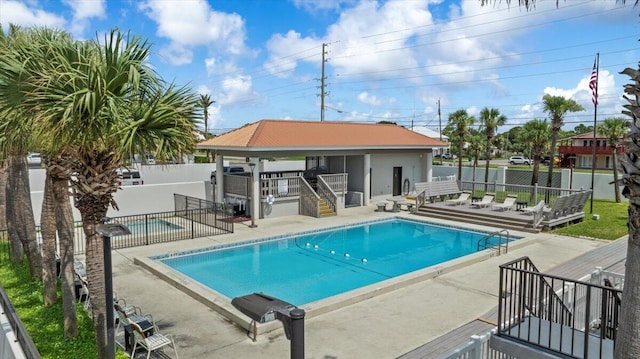 view of pool with a gazebo, a deck, and a patio area