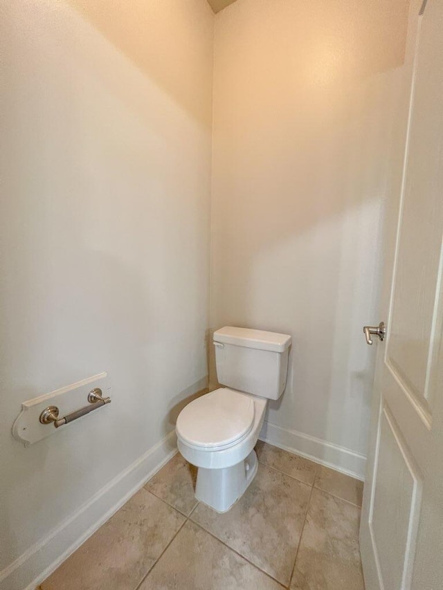 bathroom featuring tile patterned floors and toilet