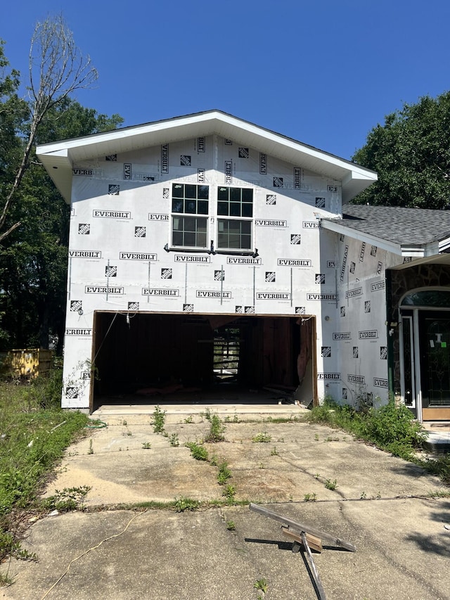 exterior space featuring concrete driveway