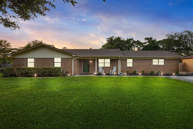 ranch-style house with a yard