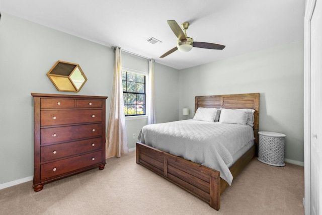 bedroom with light carpet and ceiling fan