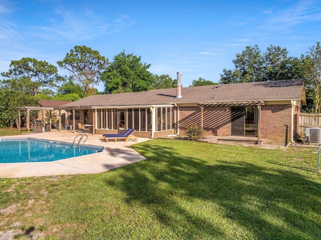 view of pool featuring a patio, central AC, and a yard