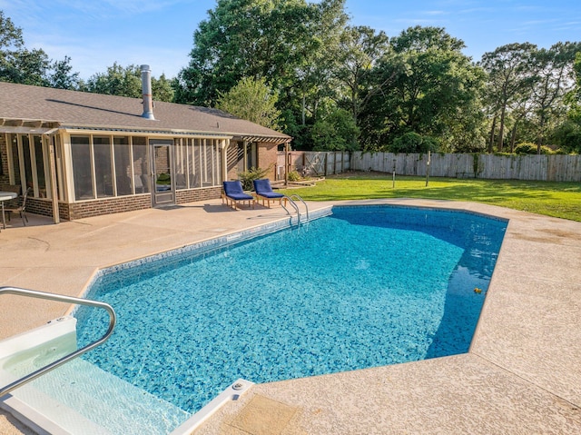 view of pool featuring a yard and a patio area