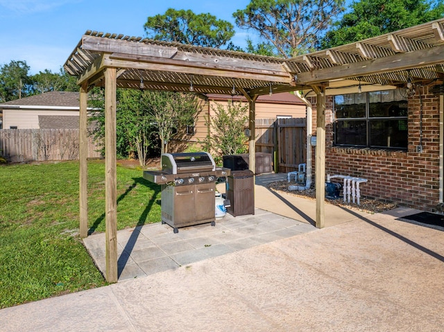 view of patio / terrace with a grill and a pergola