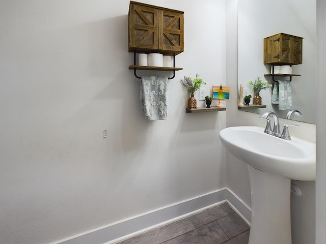 bathroom with sink and tile patterned flooring