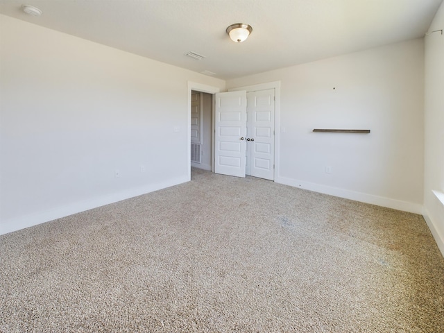 spare room featuring carpet flooring