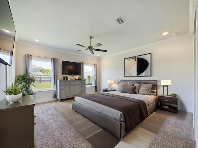 carpeted bedroom featuring multiple windows, crown molding, and ceiling fan