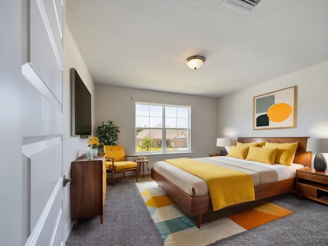 carpeted bedroom with a textured ceiling