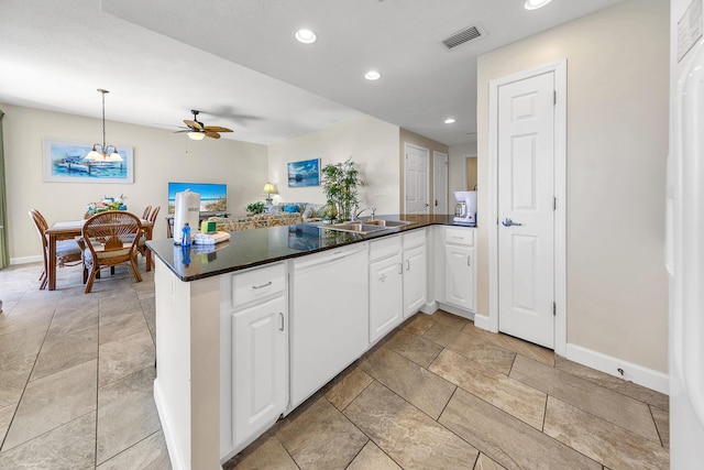 kitchen featuring white cabinetry, sink, decorative light fixtures, and ceiling fan with notable chandelier