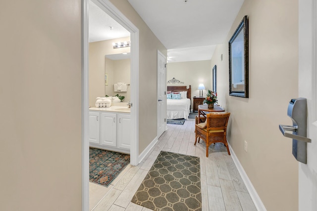 bathroom with vanity and wood-type flooring