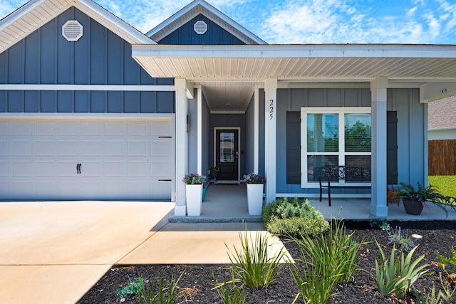 view of front of home featuring covered porch and a garage