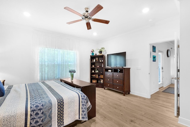 bedroom with ceiling fan, light wood-type flooring, and ornamental molding