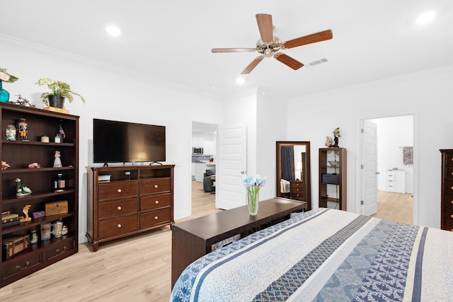 bedroom featuring ceiling fan, light wood-type flooring, and ornamental molding