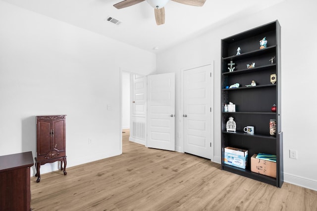 bedroom featuring ceiling fan and light wood-type flooring