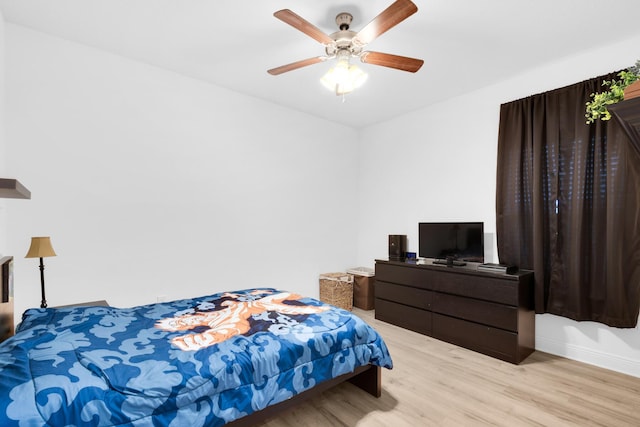 bedroom featuring ceiling fan and light hardwood / wood-style flooring