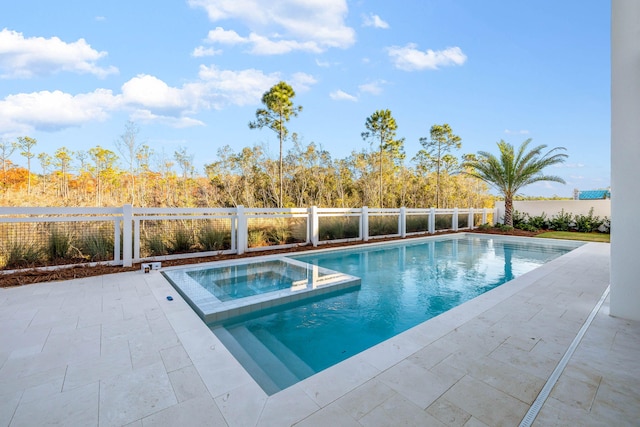 view of swimming pool with a patio area and an in ground hot tub