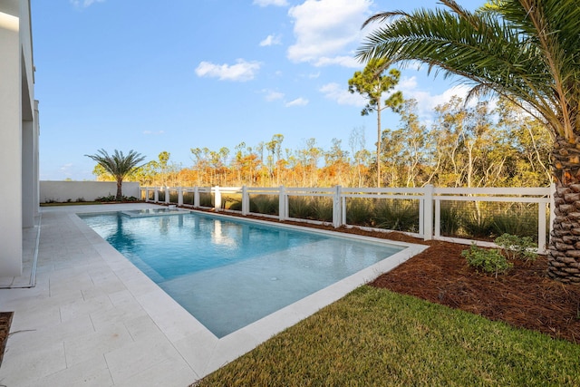 view of swimming pool with a patio