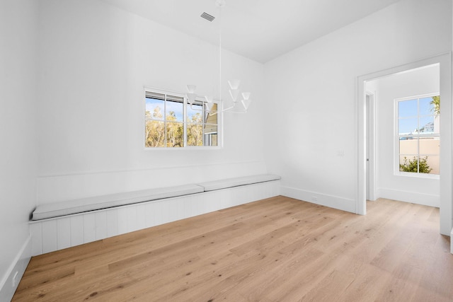 unfurnished room with light hardwood / wood-style flooring