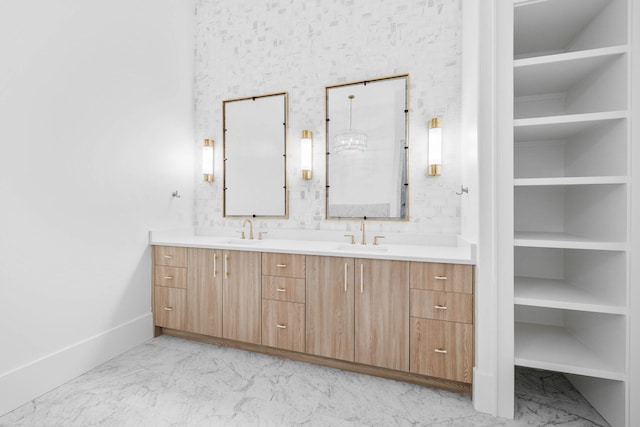 bathroom with built in shelves and vanity