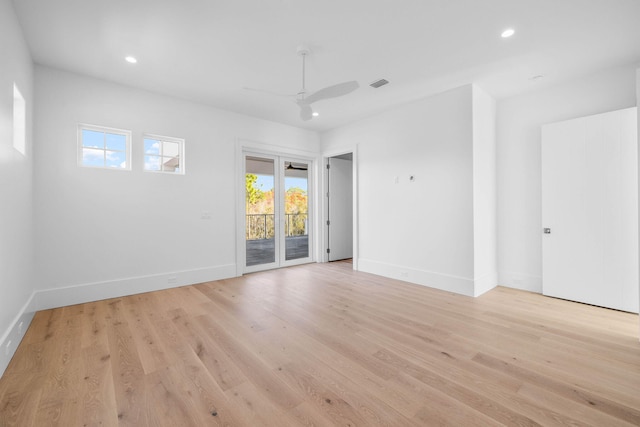 empty room featuring ceiling fan and light hardwood / wood-style floors