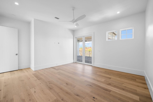 unfurnished room with ceiling fan and light hardwood / wood-style floors