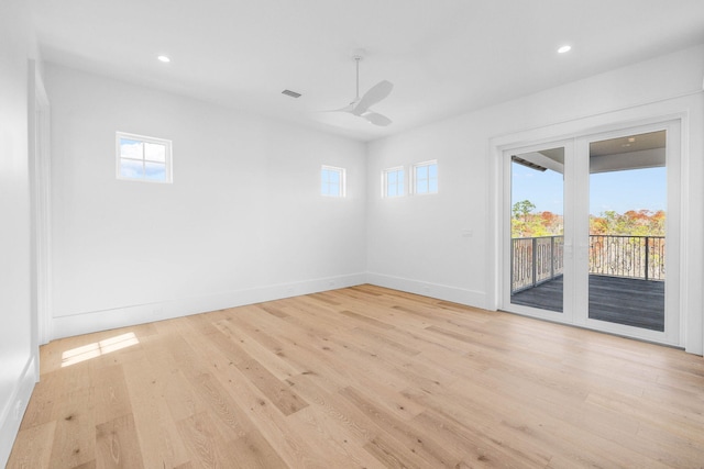 empty room featuring ceiling fan and light hardwood / wood-style floors