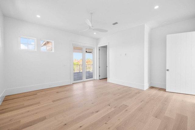 unfurnished room with ceiling fan and light hardwood / wood-style floors