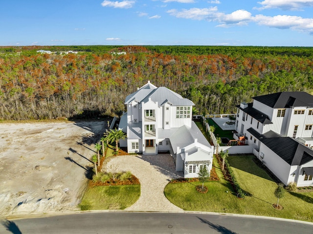 bird's eye view featuring a forest view