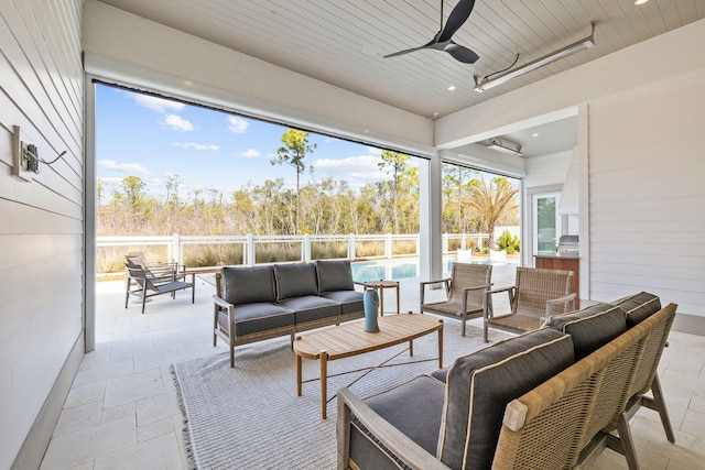 view of patio / terrace with outdoor lounge area, fence, and a ceiling fan