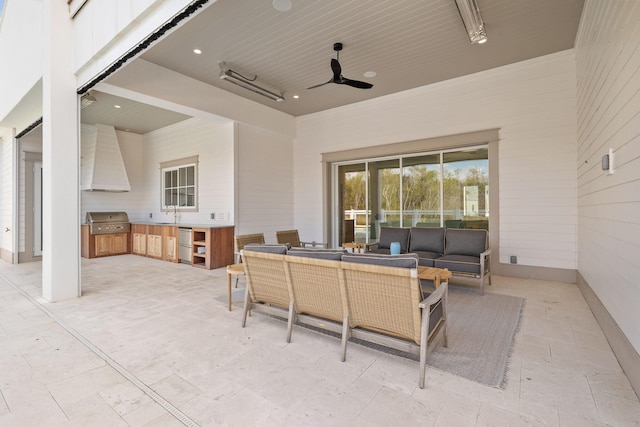 view of patio with ceiling fan, an outdoor kitchen, grilling area, and an outdoor living space