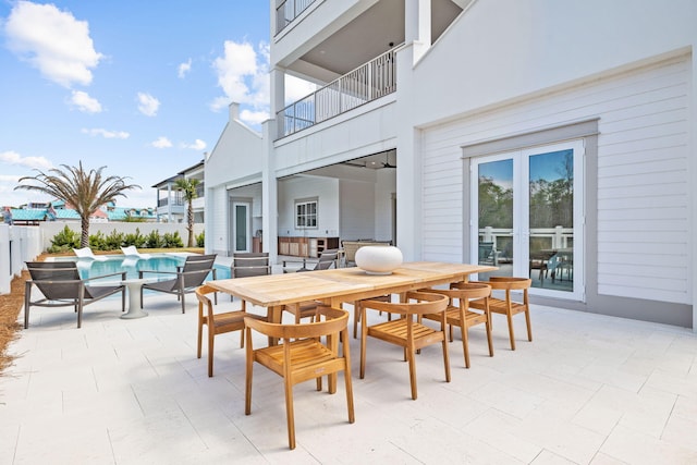 view of patio / terrace with a fenced in pool and outdoor dining area