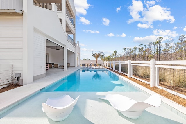 view of swimming pool featuring a patio, a fenced backyard, and a fenced in pool