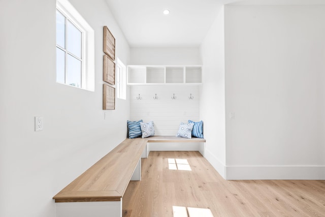 mudroom with recessed lighting, light wood-style flooring, and baseboards