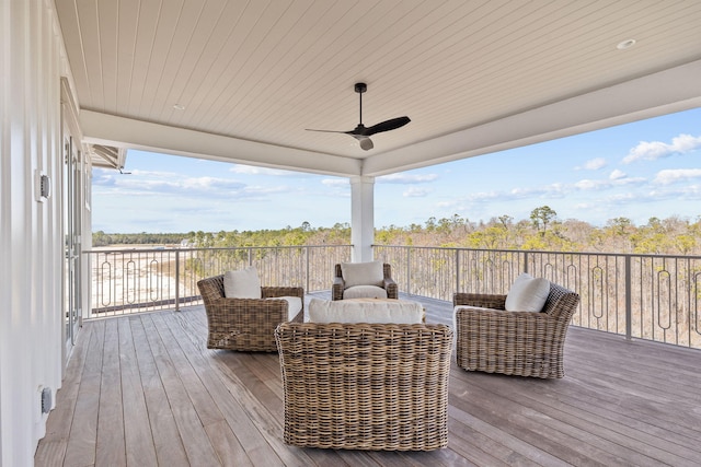 deck with a ceiling fan and an outdoor living space