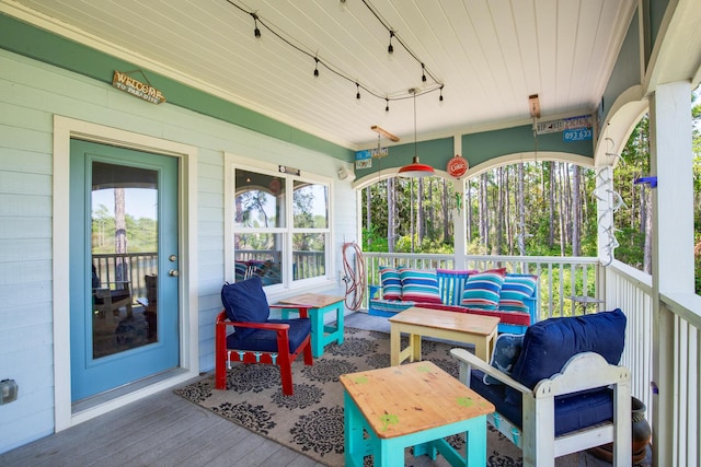 sunroom / solarium with track lighting