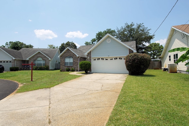 view of front of house with a front lawn, central air condition unit, and a garage