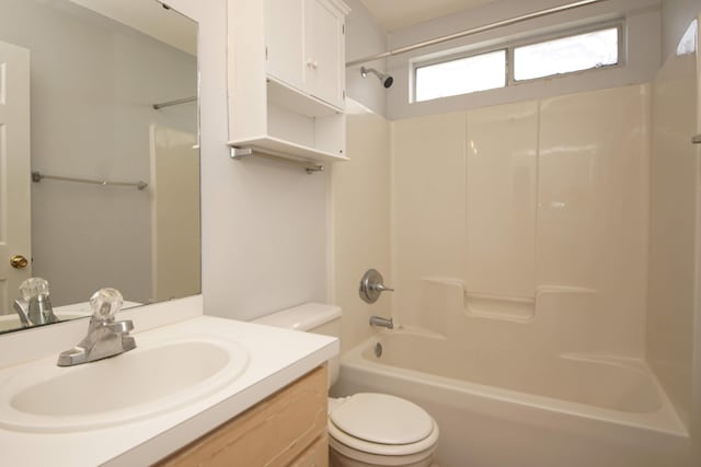 full bathroom with  shower combination, vanity, and toilet