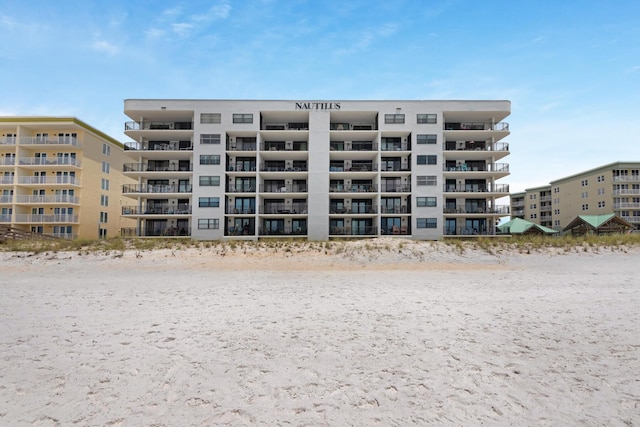 view of property featuring a beach view