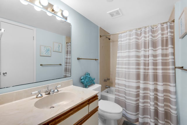 full bathroom with shower / tub combo with curtain, vanity, and toilet