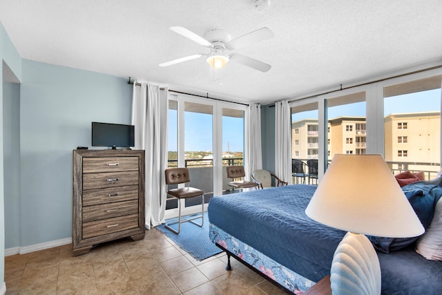 bedroom featuring ceiling fan, tile patterned flooring, a textured ceiling, and access to outside