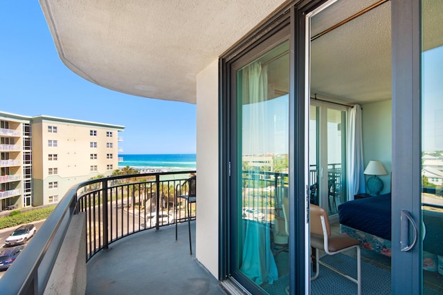 balcony featuring a water view